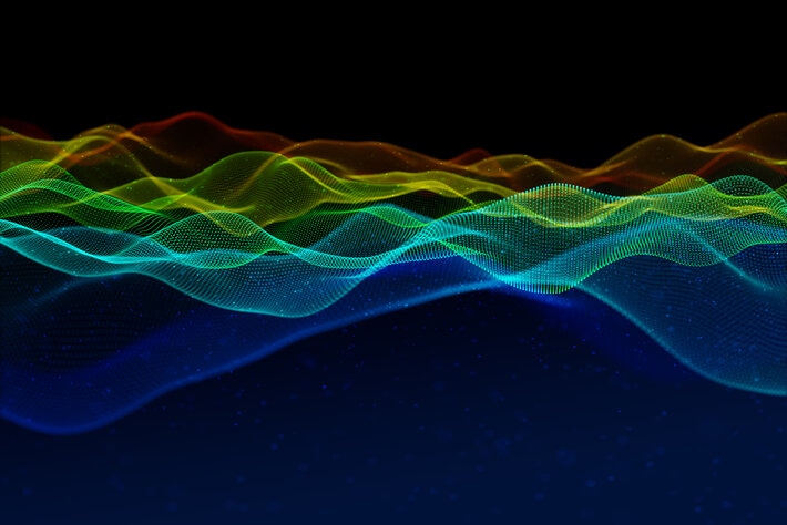 3d rainbow coloured flowing particle waves
