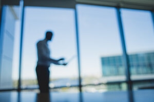 Blurred silhouette of a business man