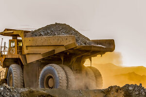 Large truck carrying sand on a platinum mining site