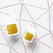 Top view of two sim cards with internet communication network