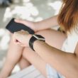 Woman using smartwatch with e-mail notifier