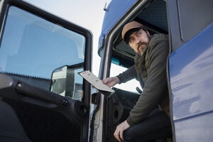 Low angle man sitting in truck