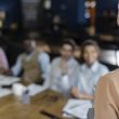 Woman holding an office meeting with coworkers