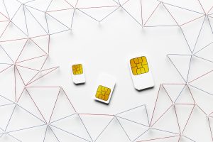 3 sim cards that are placed on a white background