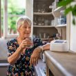 Woman with a telecare device