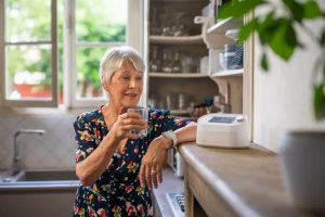 Woman with a telecare device